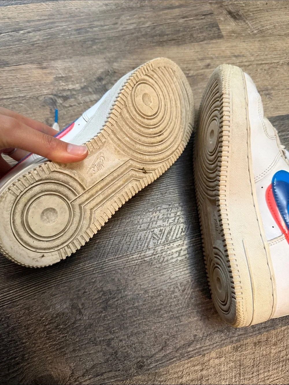 Nike White Low-Top Sneakers with Blue and Red Swoosh